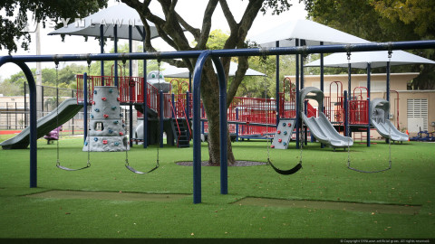 school playground on artificial grass lawn