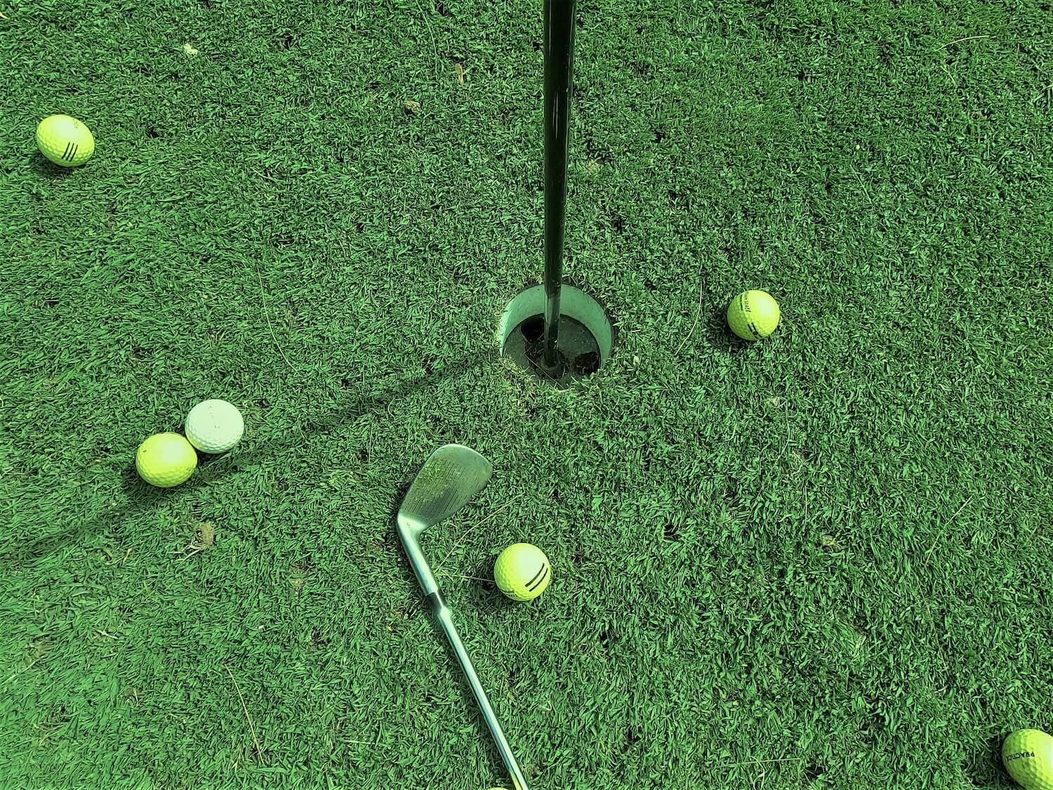 putting green with golf balls