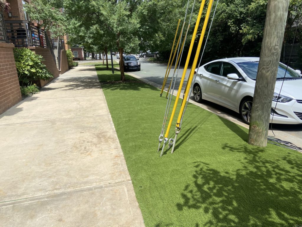 Commercial artificial grass installed by sidewalk