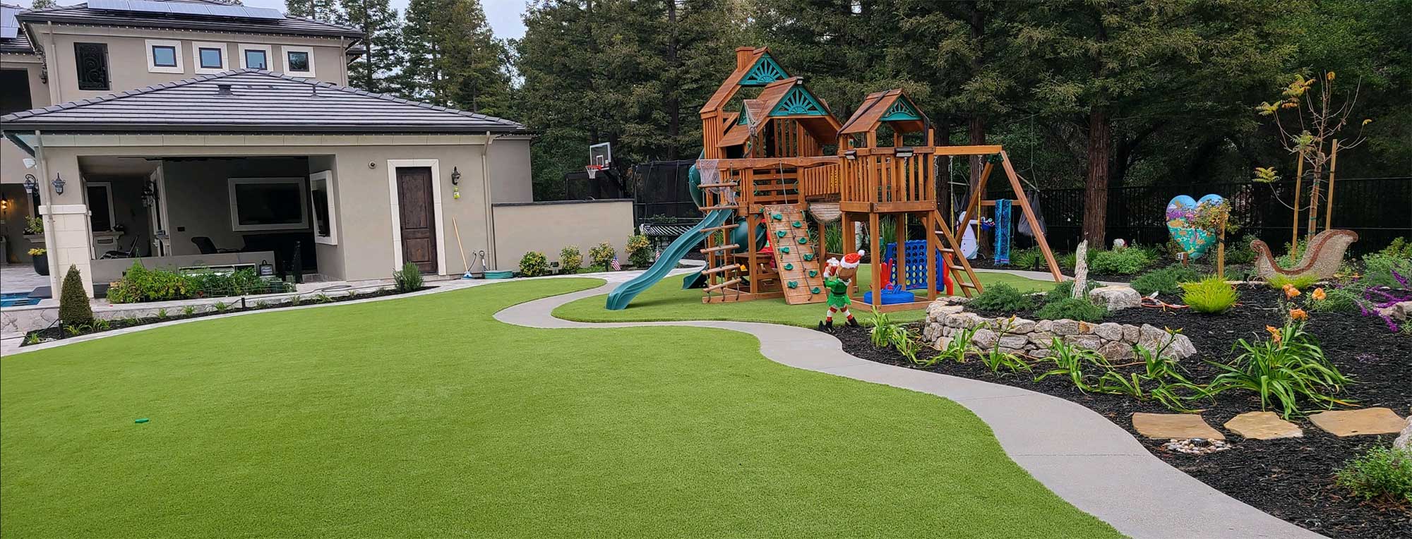 Artificial grass backyard with swingset