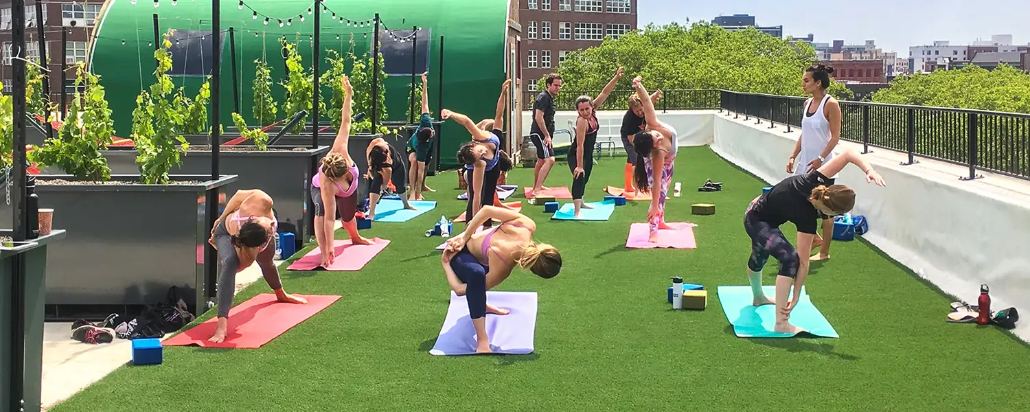 Artificial grass rooftop yoga session
