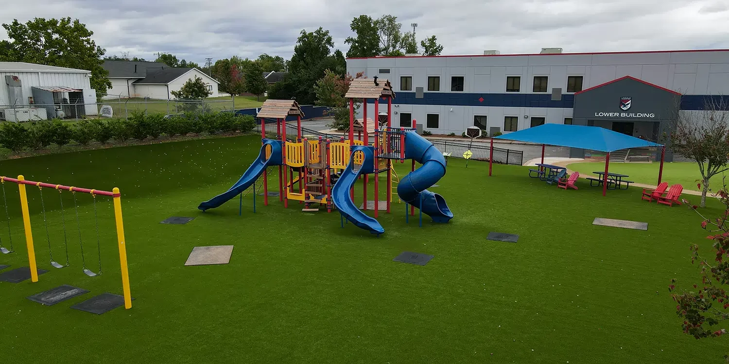 school playground on artificial grass lawn